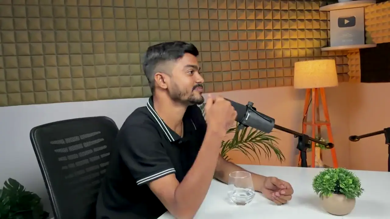A guest speaking into a Shure SM7B microphone in the TubePod Media studio